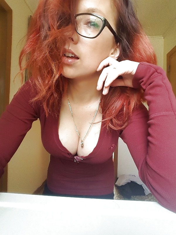 Chubby tattooed redhead with glasses strip